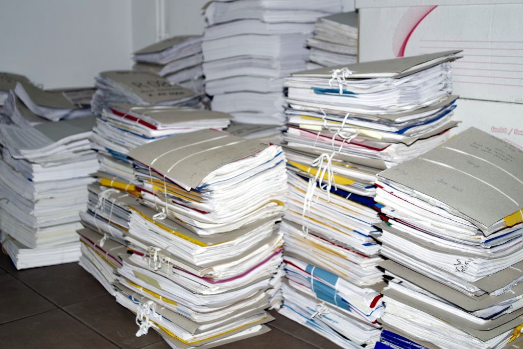 A cluttered room filled with papers.