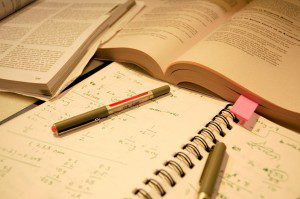 An open book displaying educational and career goals on a table.