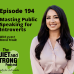 Maria Malik, a woman with long dark hair in a light blouse, stands against a green background as she shares insights in her podcast episode on public speaking for introverts.