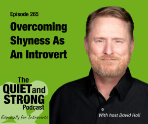 A man in a black shirt stands next to text promoting episode 265 of The Quiet and Strong Podcast about overcoming shyness as an introvert, hosted by David Hall.