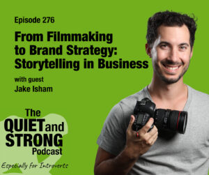 A man holding a camera stands in front of a green background with text promoting episode 276 of The Quiet and Strong Podcast featuring guest Jake Isham.